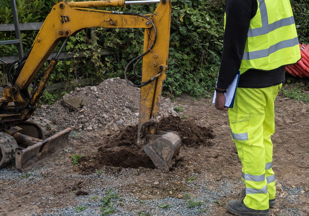 Percolation testing being carried out on a site