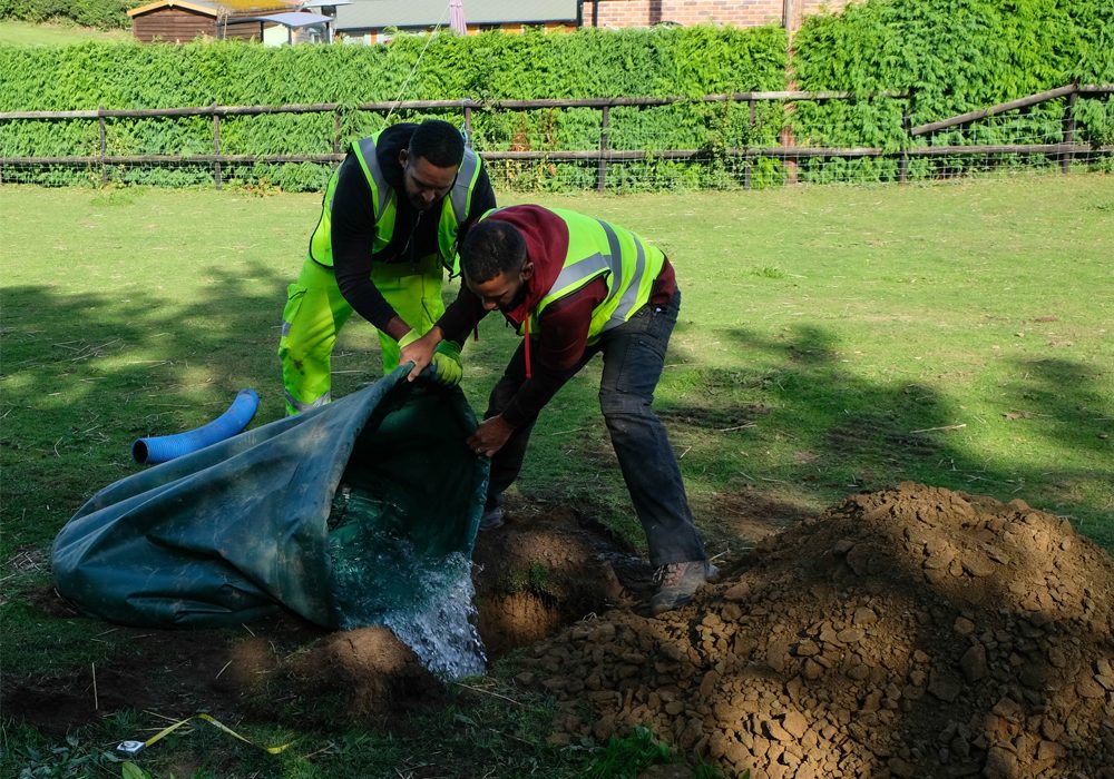 Our team carrying out a percolation test on site