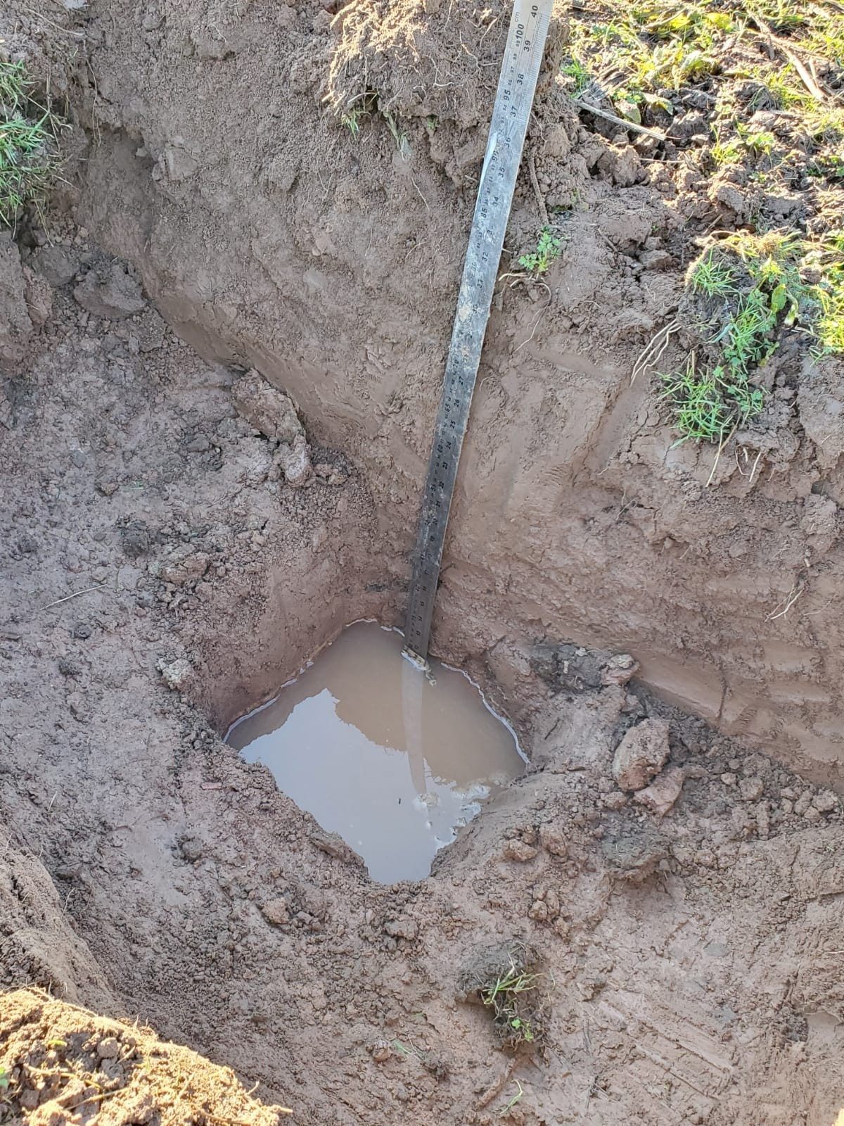 Percolation test trial pit excavated on site in Worcestershire